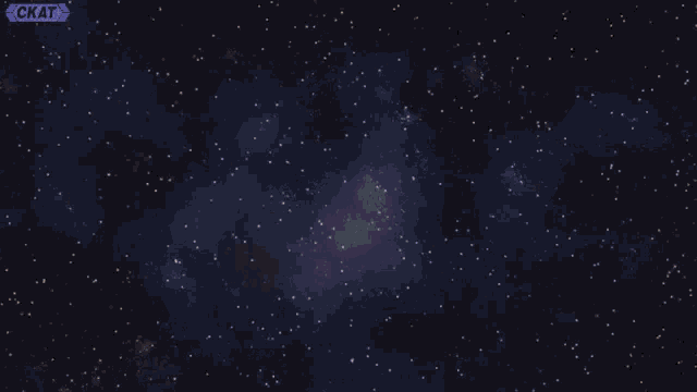 a man wearing headphones is sitting in front of a screen with a galaxy in the background .