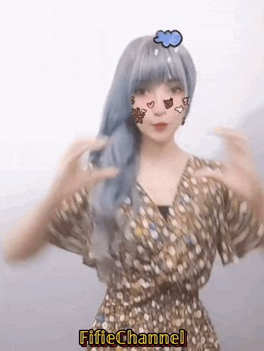 a girl with blue hair is wearing a floral dress and has a cloud on her head with the words fifie channel below it
