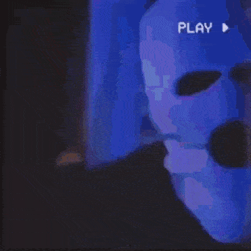 a close up of a person 's mouth with fangs and the word play visible