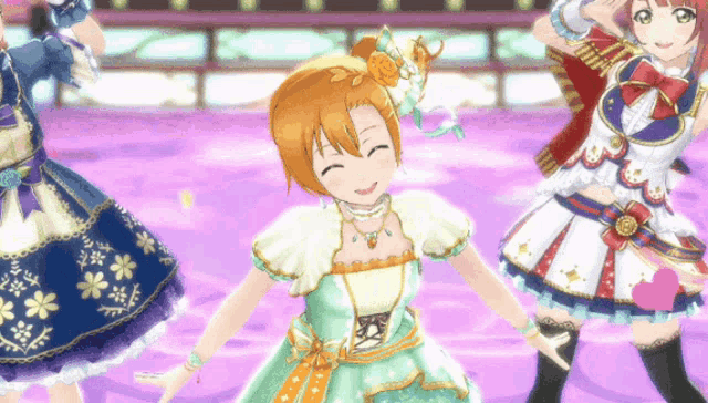 three anime girls are dancing on a stage and one of them is wearing a green dress with flowers on it
