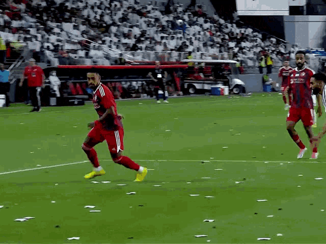 a soccer player with the number 7 on his jersey kicks the ball
