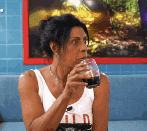 a woman in a tank top with the word wild on it