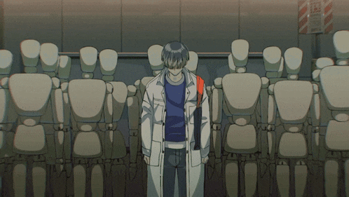 a row of cylinders are lined up in a dark room .