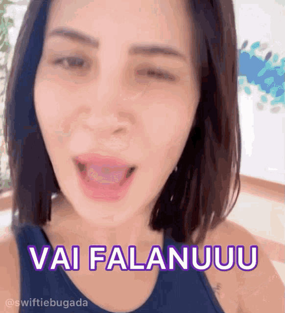 a woman in a blue tank top says vai falanuuu