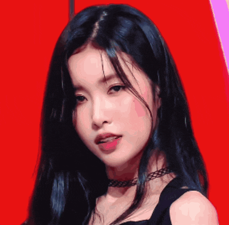 a woman with long black hair and a choker on her neck