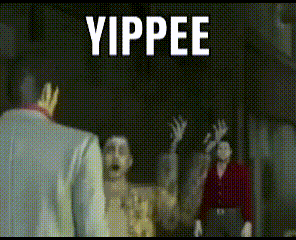 a group of people standing in a dark room with the word yippee written in white