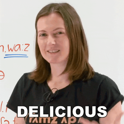 a woman wearing a black shirt says delicious