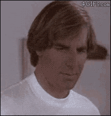 a close up of a man 's face with a 4gifs.com watermark on the bottom