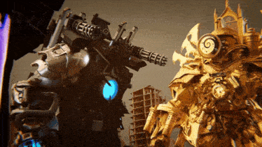 two robots are standing next to each other and one has a gun on its back