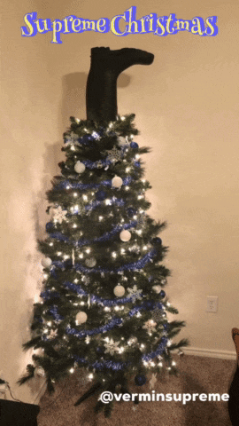 a picture of a supreme christmas tree with a boot sticking out of it