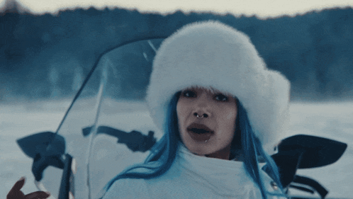 a woman with blue hair and a white fur hat