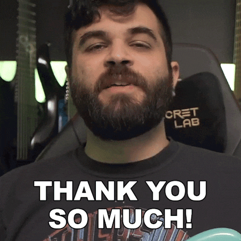 a man with a beard wearing a shirt that says " thank you so much "