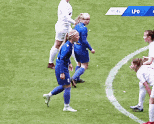 a soccer player with the number 18 on her jersey is kneeling on the field