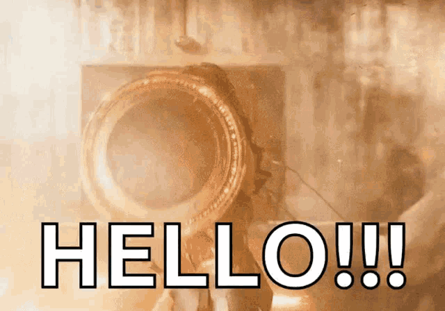 a sign that says hello on it with a person behind it