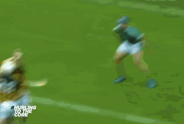 a blurry picture of a soccer game with the words hurling to the core