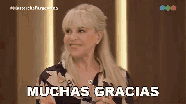 a woman says muchas gracias in spanish on a television screen