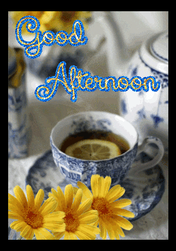 a cup of tea with a lemon slice and the words good afternoon written above it