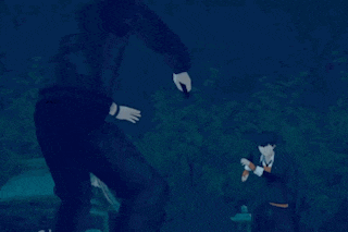 a man in a black jacket is standing next to another man in a black jacket