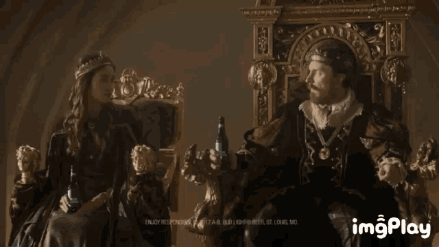 a man in a crown is sitting on a throne next to a woman holding a bottle of beer