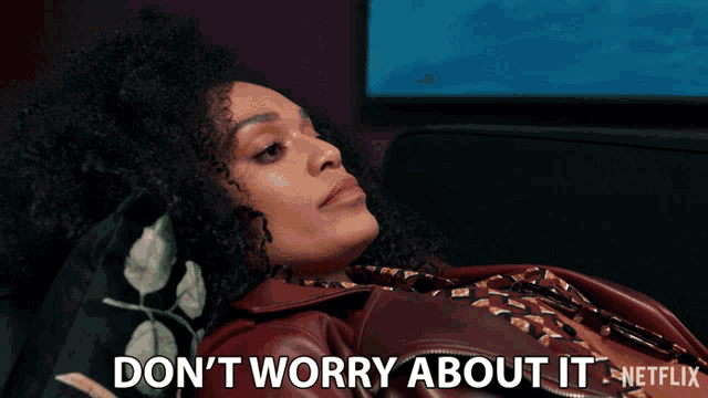 a woman laying on a couch with the words " do n't worry about it " written below her