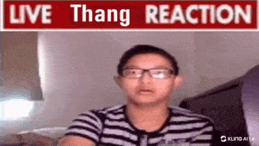 a boy with glasses is sitting in front of a sign that says live thang reaction
