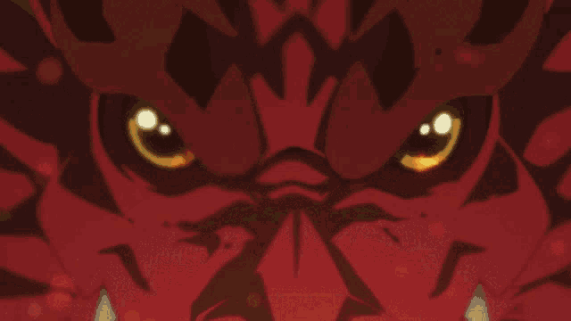 a close up of a red monster 's eyes with glowing yellow eyes