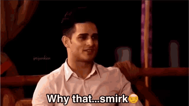 a man in a white shirt is saying why that smirk .