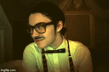 a man wearing glasses and a bow tie says " now this is how i 'm going to destroy your sex life "