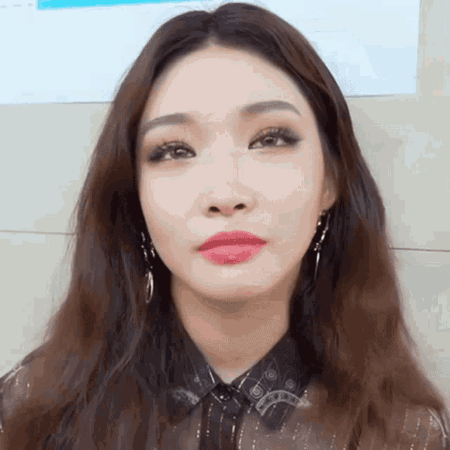 a close up of a woman 's face with long hair
