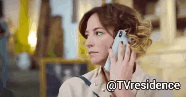 a woman is talking on a cell phone with the hashtag @tvresidence
