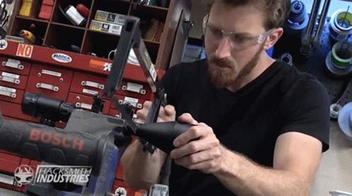 Sawing Serious GIF - Sawing Serious Focus GIFs