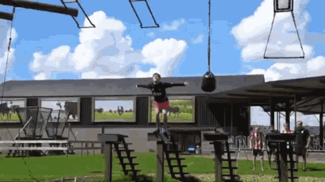 a person is jumping in the air while wearing a black shirt that says united