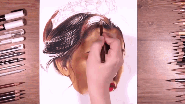 a person is drawing a picture of a woman 's face with colored pencils