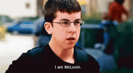a young boy wearing glasses and a black shirt says i am mclovin