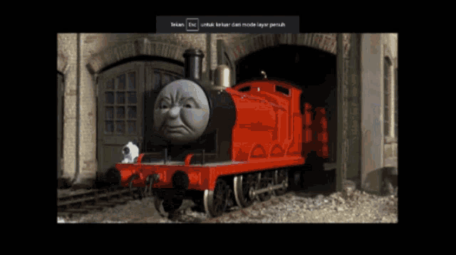 a picture of a red train with an angry face is displayed on a screen