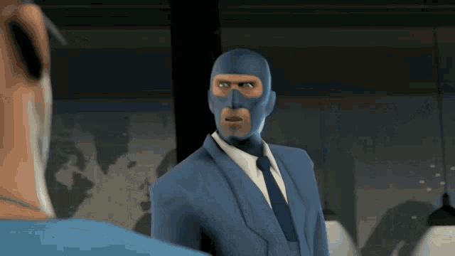 a man in a blue suit and tie with a blue mask on his face