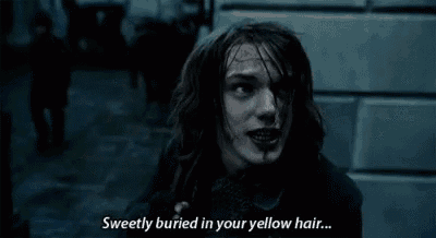 a close up of a person 's face with the words `` sweetly buried in your yellow hair . ''