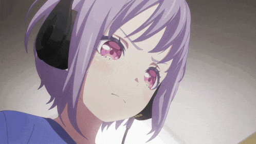 a girl with purple hair is wearing headphones and looking at the camera