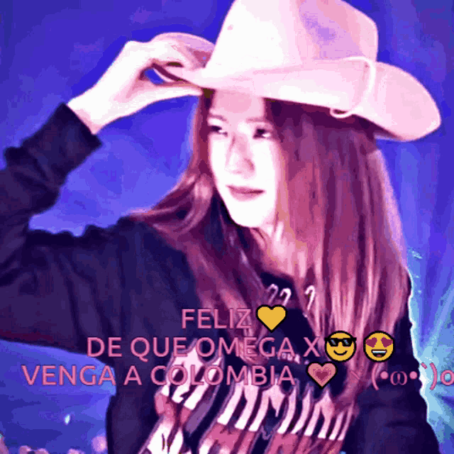 a woman wearing a pink cowboy hat with feliz de que omega x venga a colombia