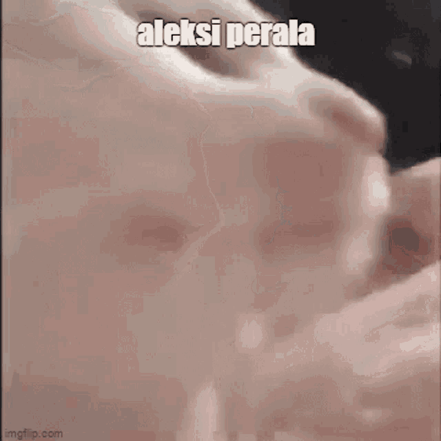 a close up of a person 's face with the words aleksi perala written on it