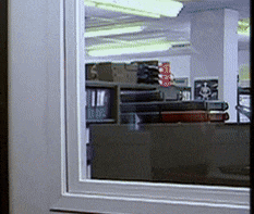 a window with a reflection of a room with a sign that says ' s. ' on it
