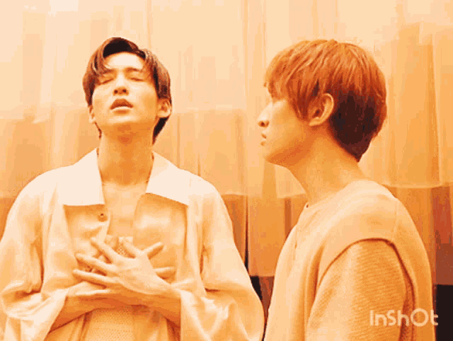 two men are standing next to each other with their eyes closed and a watermark that says inshot on the bottom