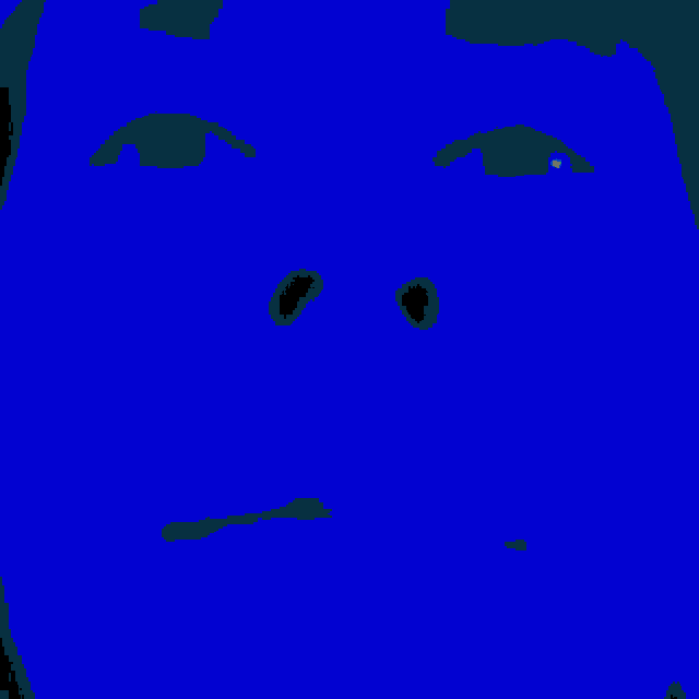 a close up of a person 's face with red and green lighting