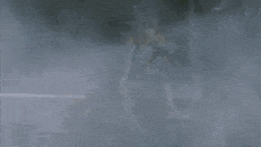 a robot is flying through the air in a foggy area