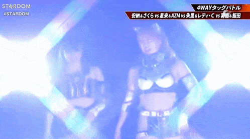 two women are dancing on a stage and the words stardom are on the bottom