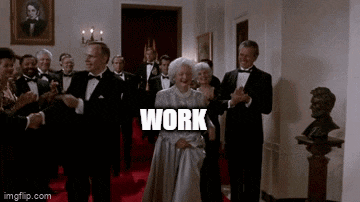 a woman in a white dress is standing in front of a group of men in tuxedos and the word work is on the screen