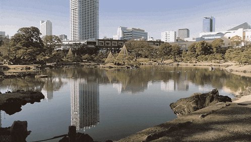 a large body of water surrounded by trees and buildings with the word orro on the bottom