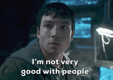 a man is sitting in front of a computer monitor and says `` i 'm not very good with people '' .