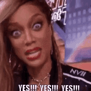 a woman is making a funny face and saying `` yes !!! yes !!! yes !!! ''