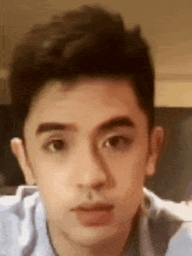a close up of a man 's face with his eyes closed .